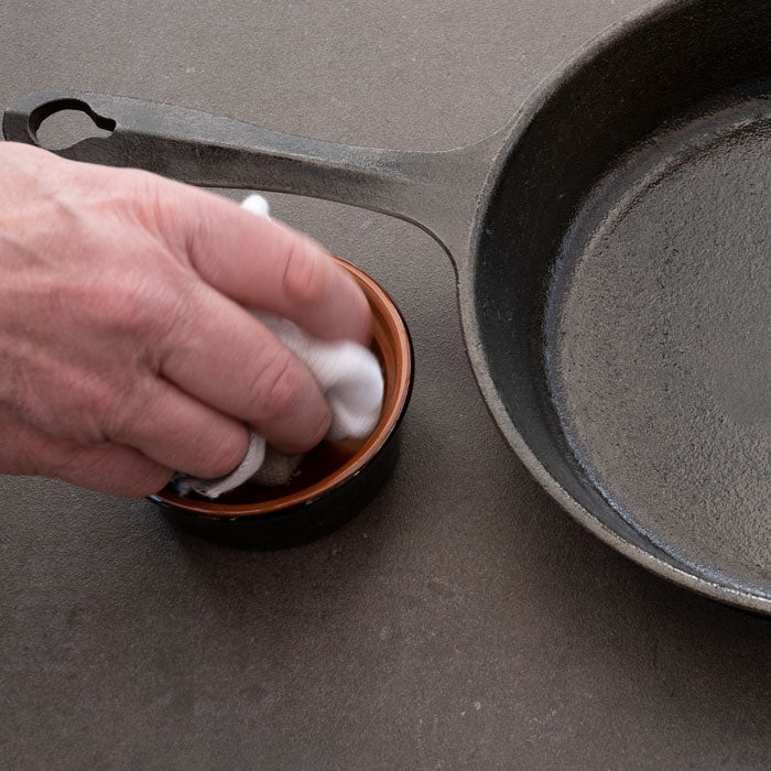 Re-seasoning a cast iron pan